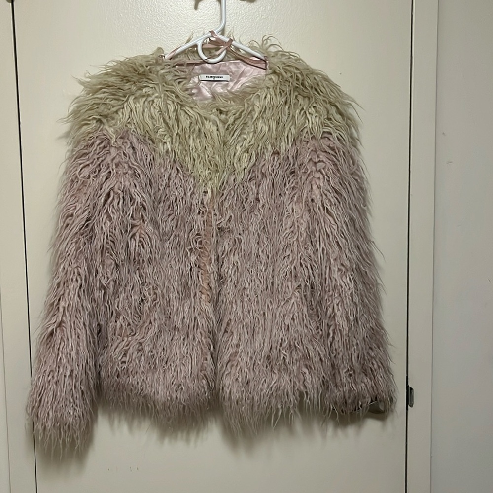 Worn twixe shaggy fur jacket